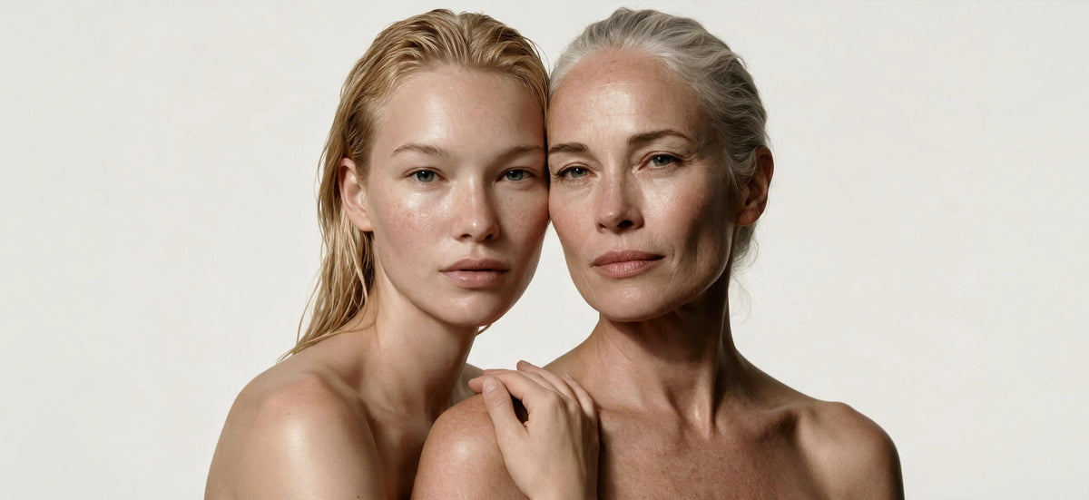 Two women with natural skin tones posing closely together against a plain light background. [AI]